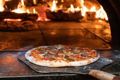 Dit is de nummer 1 bestemming voor pizza in de VS—en nee, het is niet New York of Chicago.